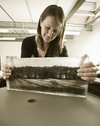 Helen Slater Stokes grinding glass on flatbed