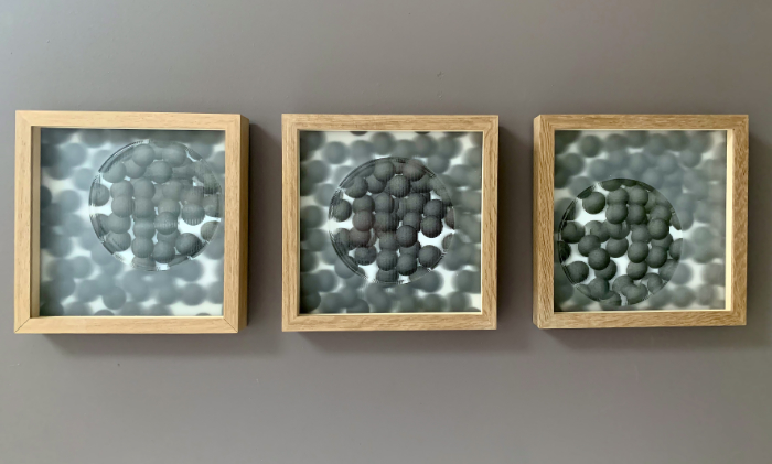Glass wall art called Proximity