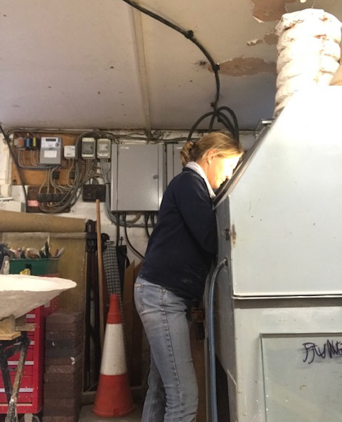 Cara Wassenberg at work with the sandblaster.