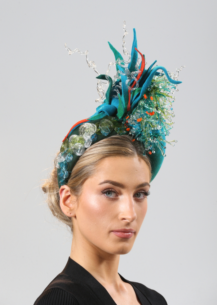 Headwear with flame worked glass