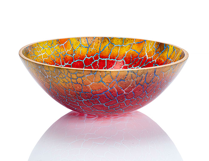 Transition of transparent reds to marigold, with veining in various blues, in this kiln formed glass bowl from the Homecoming Series.