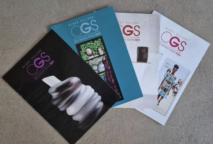 A display of covers of 4 copies of New Graduate Review magazine