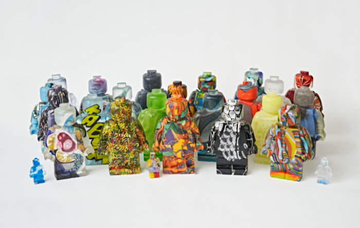 The Recycling Narratives: Whispering Sweet Nothings glass artwork series made by Hannah Gibson features figures made from all sorts of recycled glass