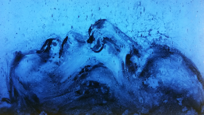 ‘Emerged’ (2017), portrait of a face in profile in painted grisaille fired on mouth-blown glass.