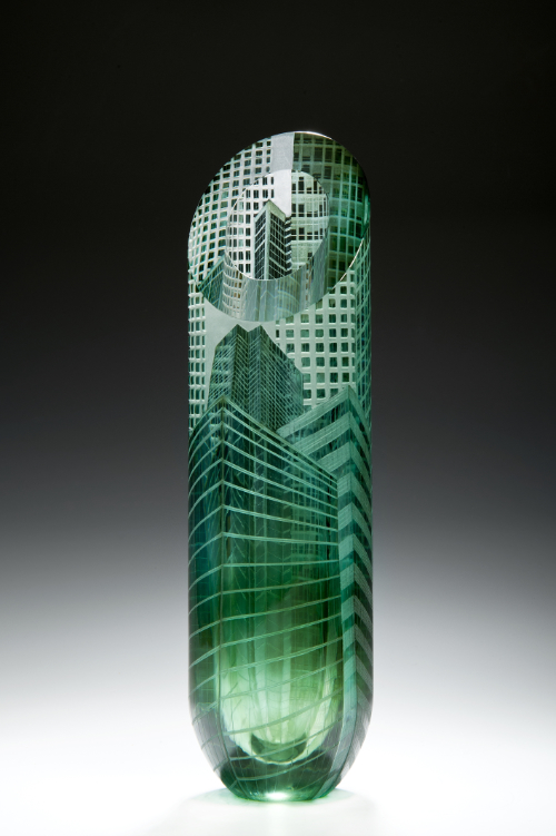 Canary Wharf Vase (2013) features grey over green glass overlaid on clear lead crystal, blown by Andy Potter, and wheel engraved by Katharine Coleman.