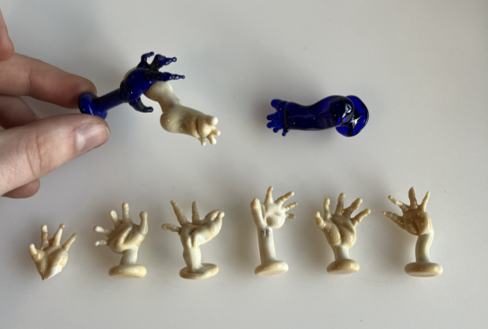 Sample glass hands and feet lampworked by Kerry Collison and submitted as part of her prize entry.