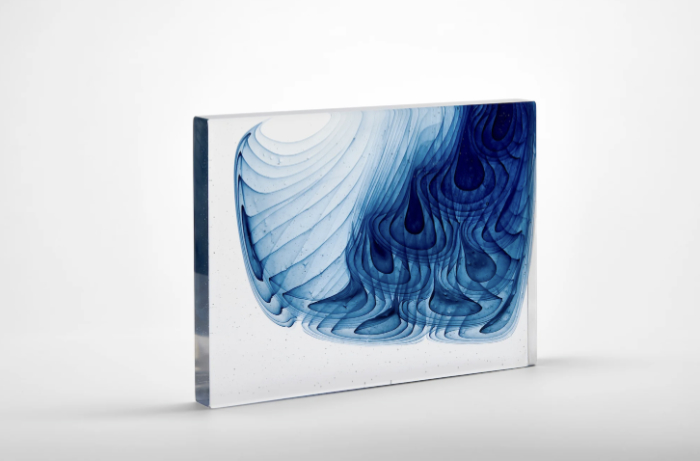 Kiln-formed glass art panel featuring swirling blue pattern by Helen Restorick.