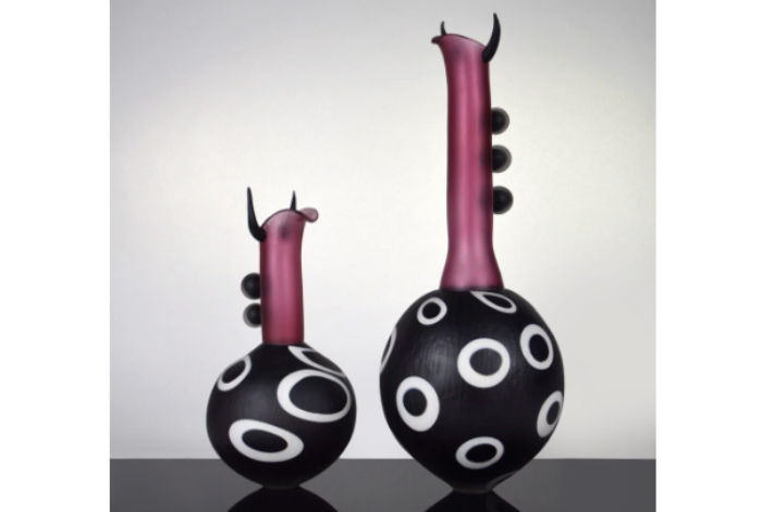 Two blown glass vessels made by Theo Brooks inspired by bulls.