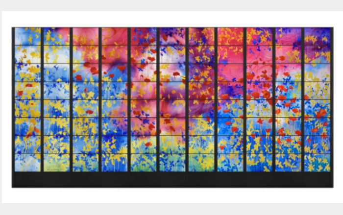 Brian Clarke's large glass panel called Ardath, meaning blooming meadow - 450 square foot in size it features bright colours of abstracted flowers in blues, pin, red, yellow and green across the expanse of 11 pillars of 8 panels.