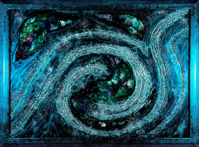 Glass wall art piece in black and blues made using secret technique called lavacoaqting.