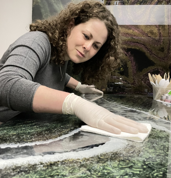 Glass artist Carolin Zibulka working on her artwork.