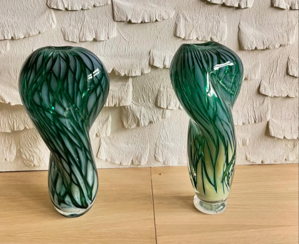 Two dark green tone vases in twisted shape called Twisted Trees.